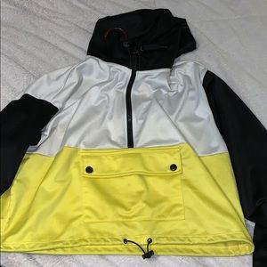 Black yellow and white half zip .